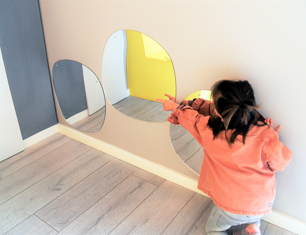 Fun shaped mirrors plus child