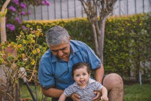 Granparent playing outside with child